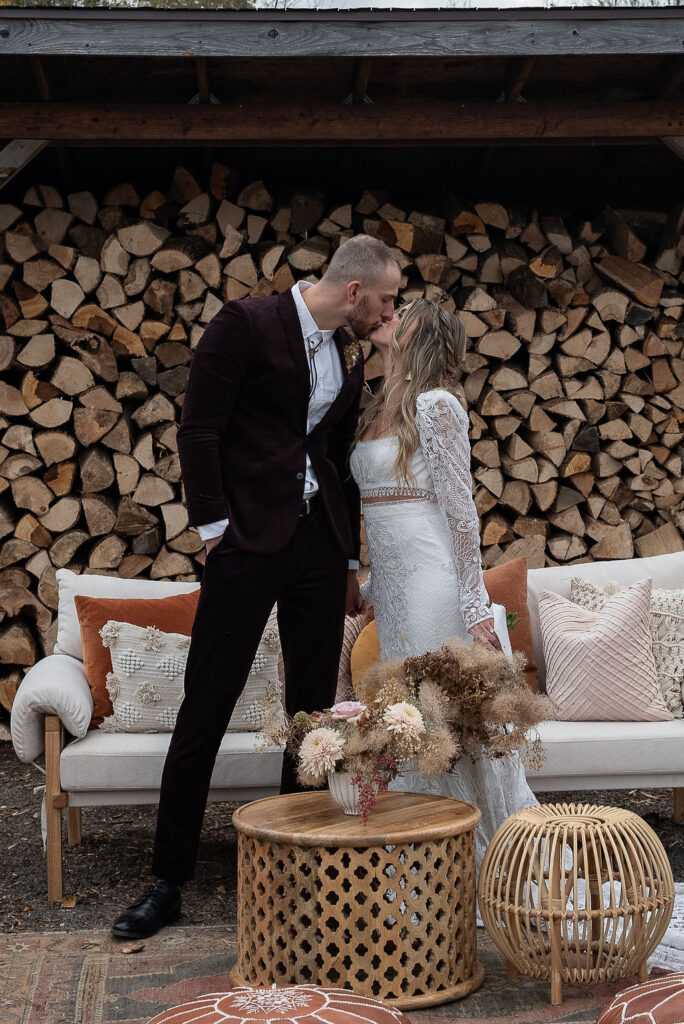 bride and groom kissing at their elopement reception