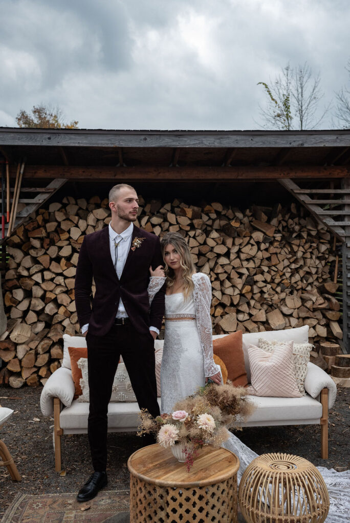 Elope at Firelight Camps in Ithaca, NY - bride and groom posing at the camera 