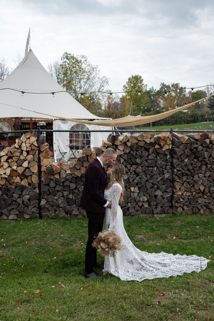 bride and groom kissing a their wedding reception