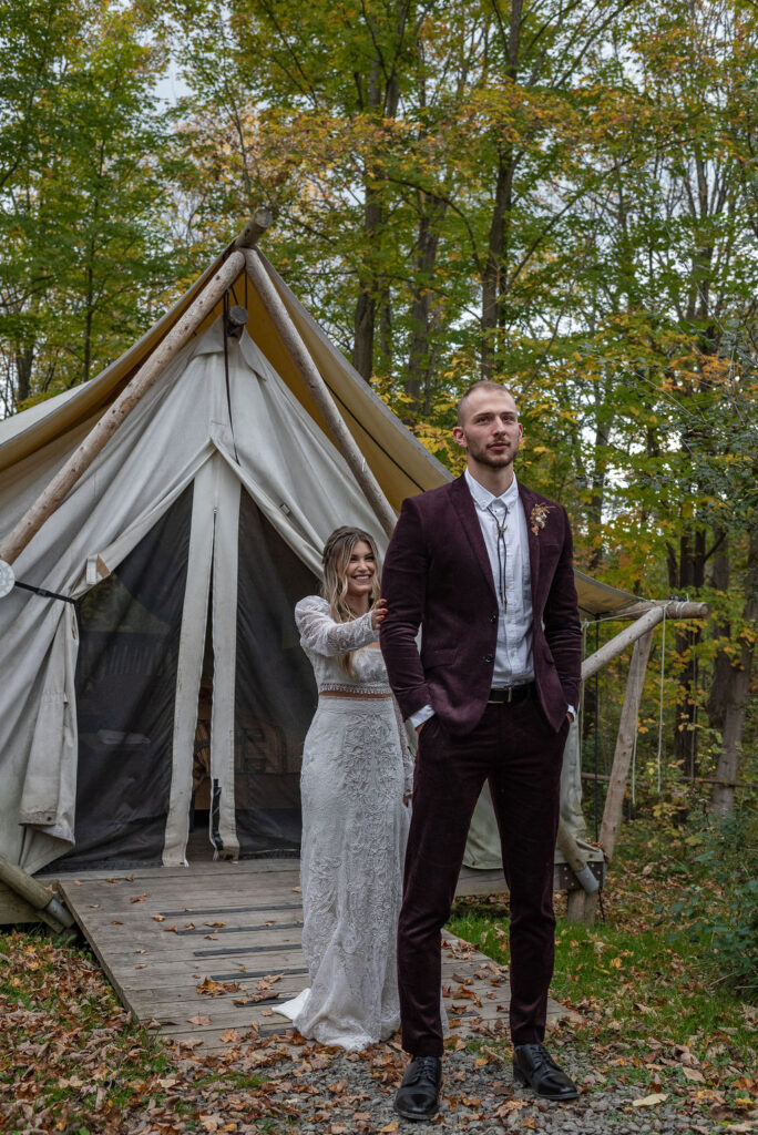 bride touching the grooms shoulder for their first look