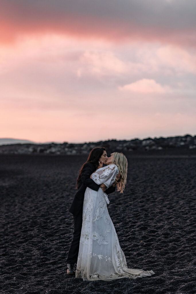 newly eloped couple kissing 