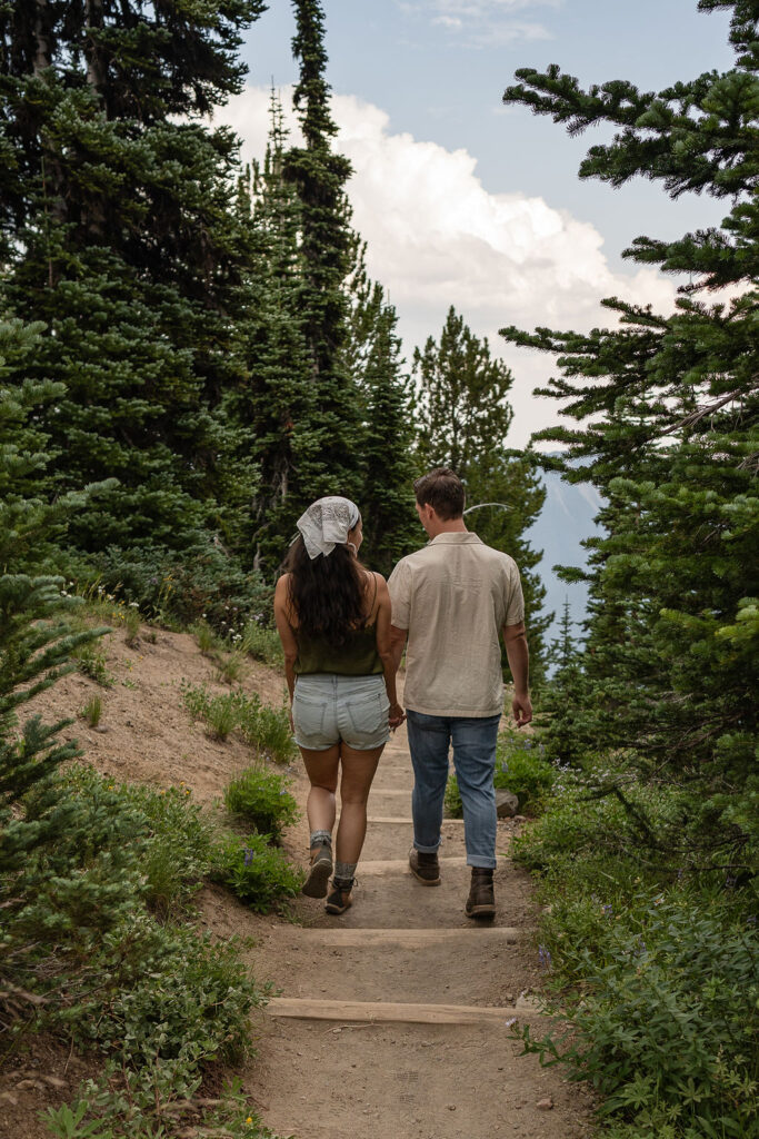 couple walking around mt rainer NP