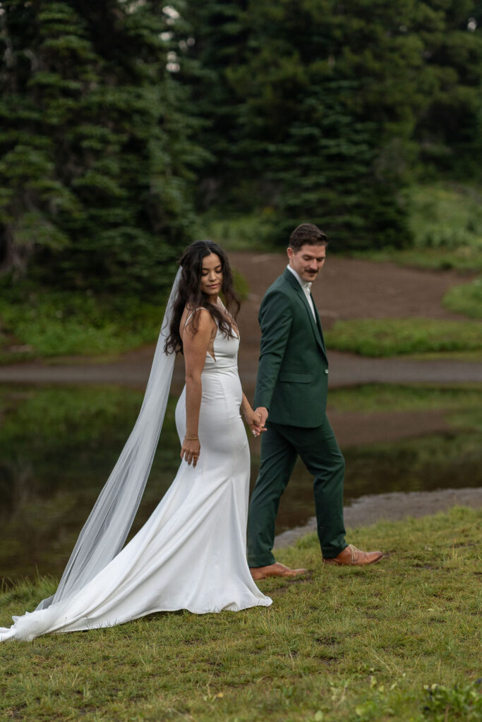 bride and groom holding hands