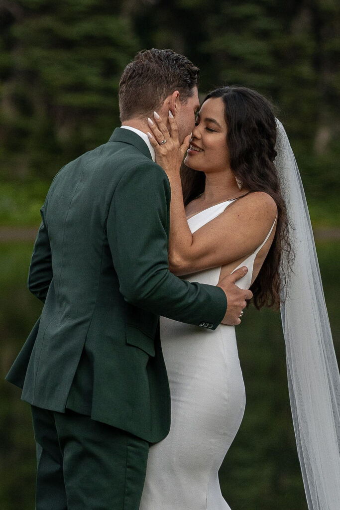 cute couple kissing before their ceremony 