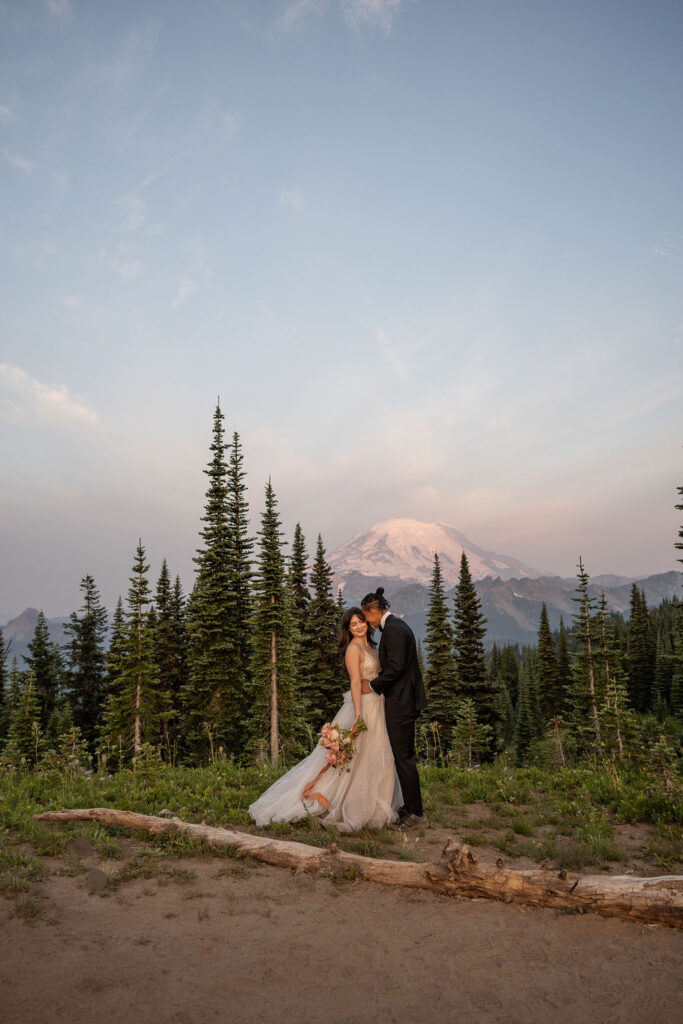 bride and groom kissing during their photoshoot