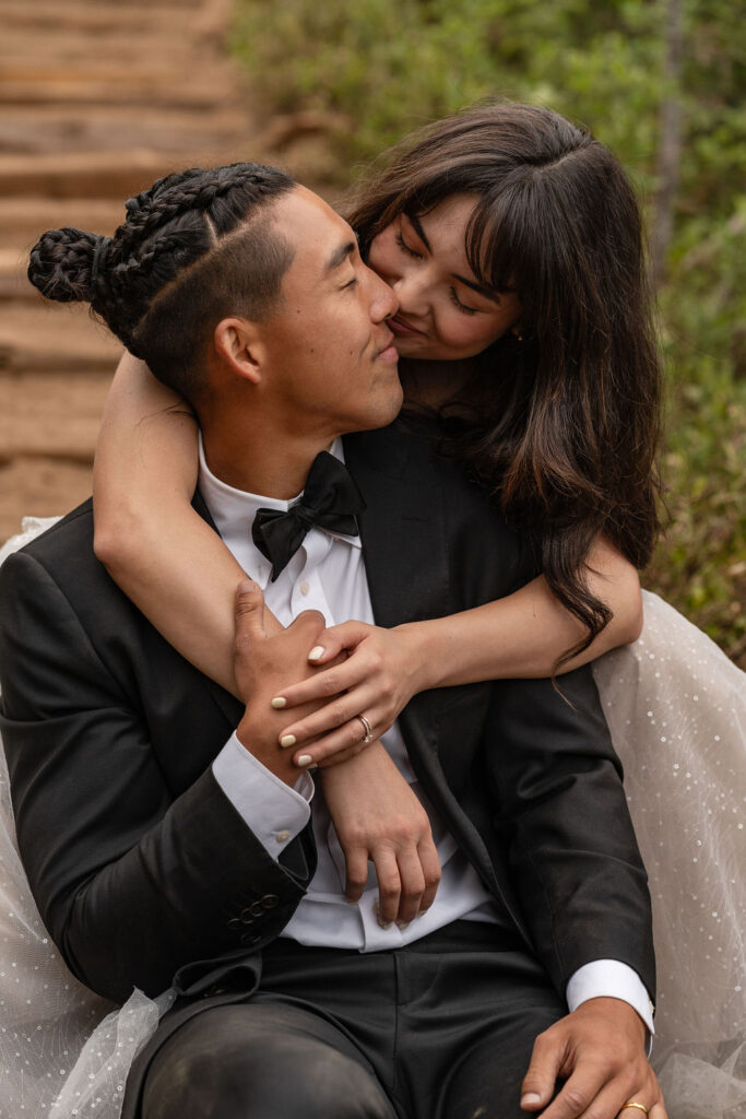 bride kissing the groom on the cheek