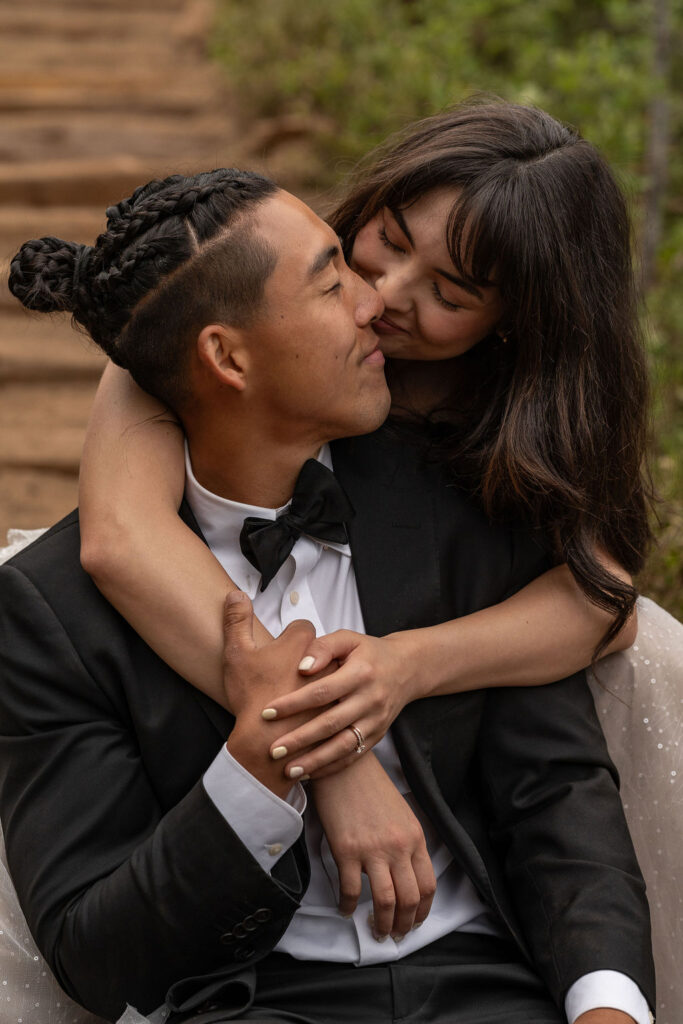 bride kissing the groom on the cheek