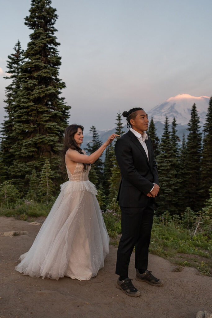 bride and groom at their first look - elope in mt. rainier