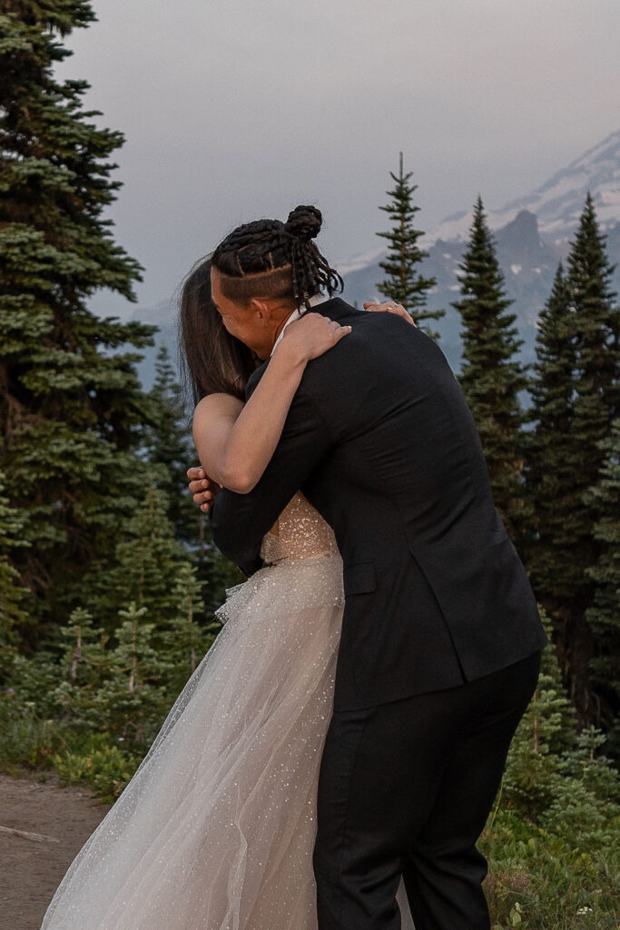 bride and groom hugging after their first look