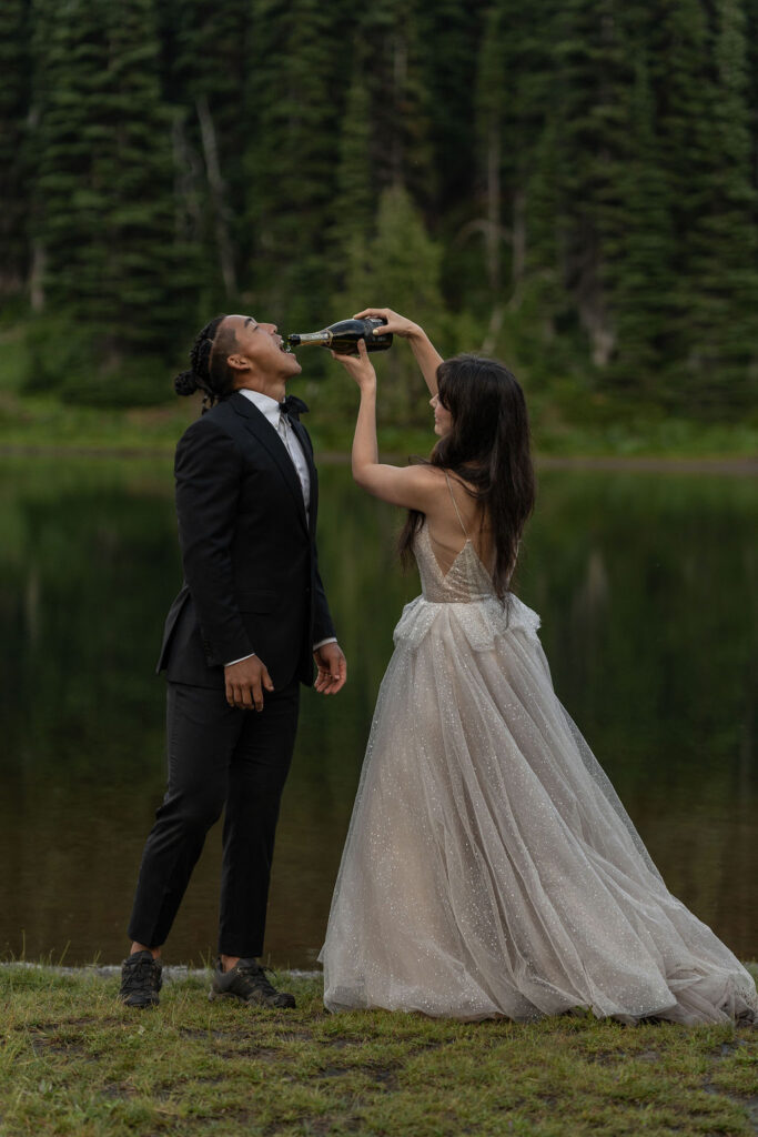 bride and groom drinking champagne 