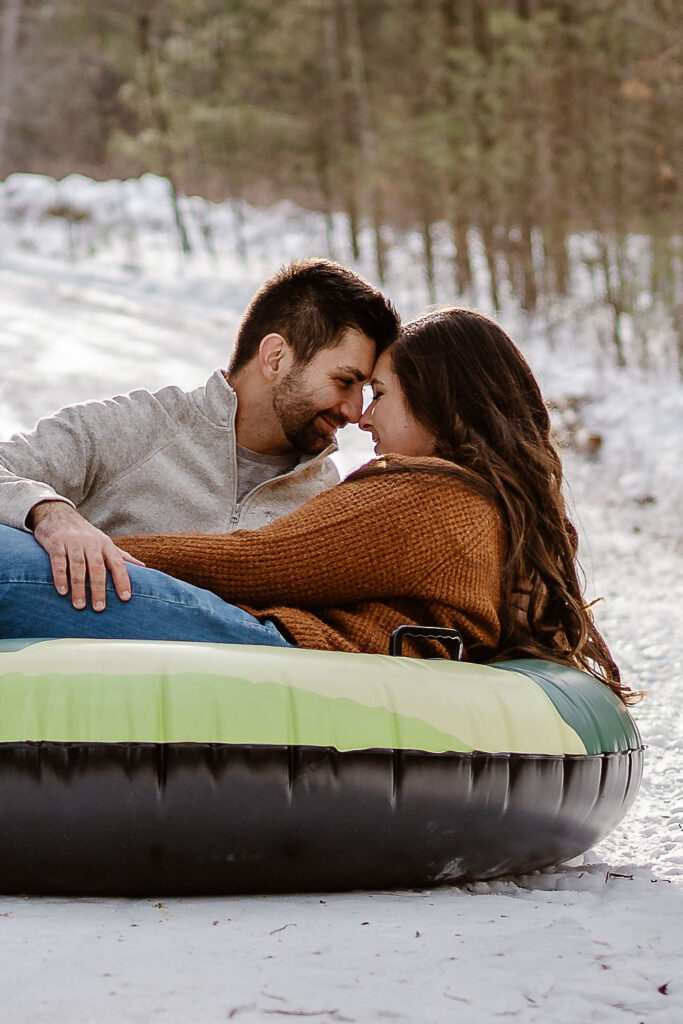 cute couple looking at each other during their session in lake george 