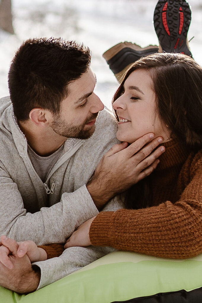 picture of the couple looking at each other during their winter couple photoshoot