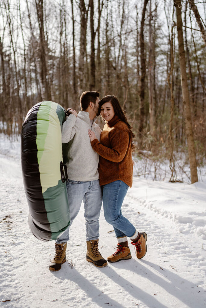 fiance kissing his fiance on the cheek