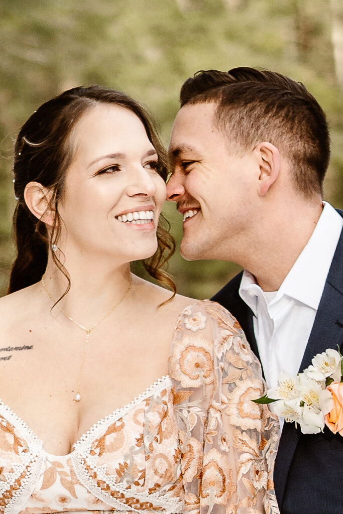 bride and groom smiling at the camera