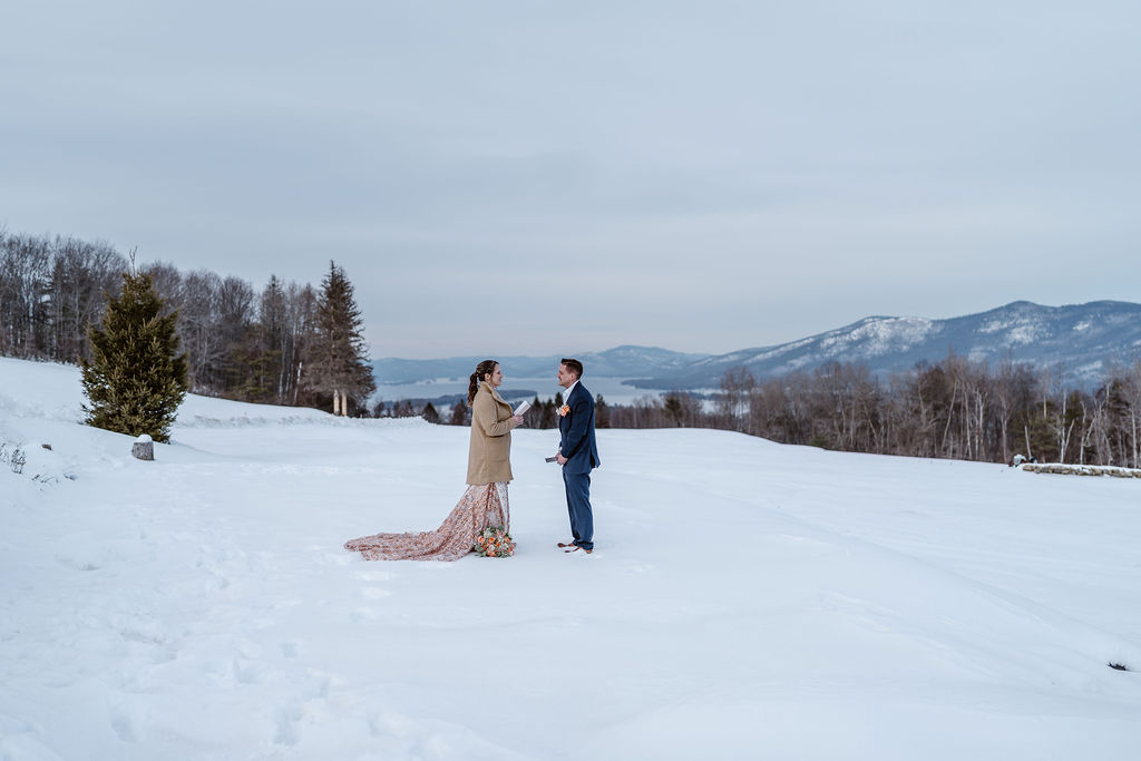 bride and groom reading their vows at their winter elopement 