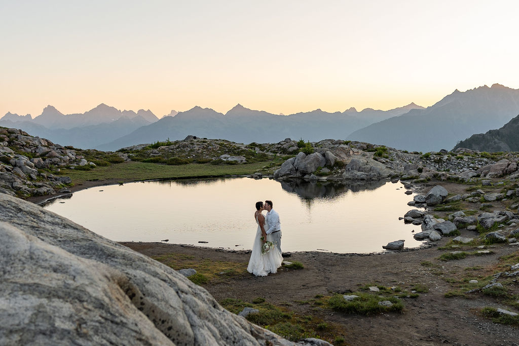 bride and groom kissing during their photoshoot