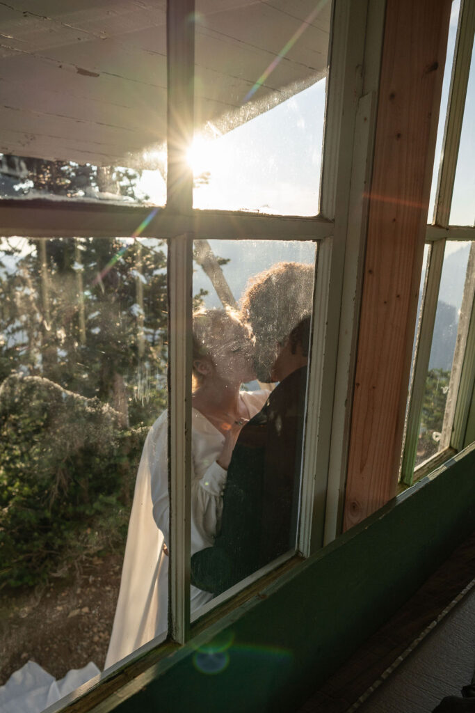 portrait of the bride and groom kissing 