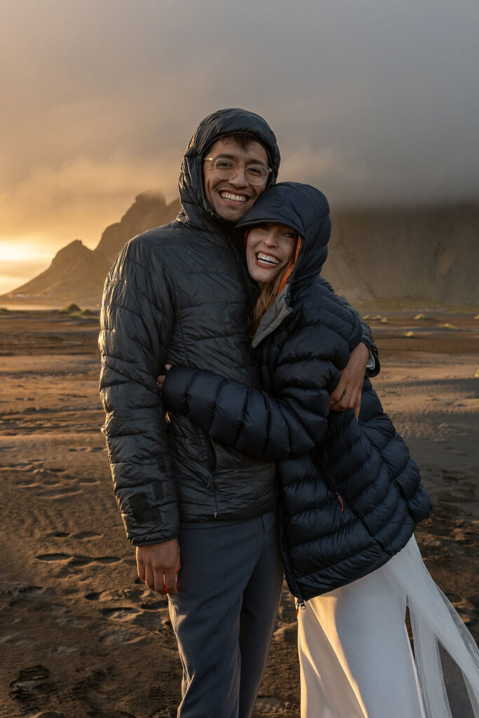 couple smiling to the camera during their session