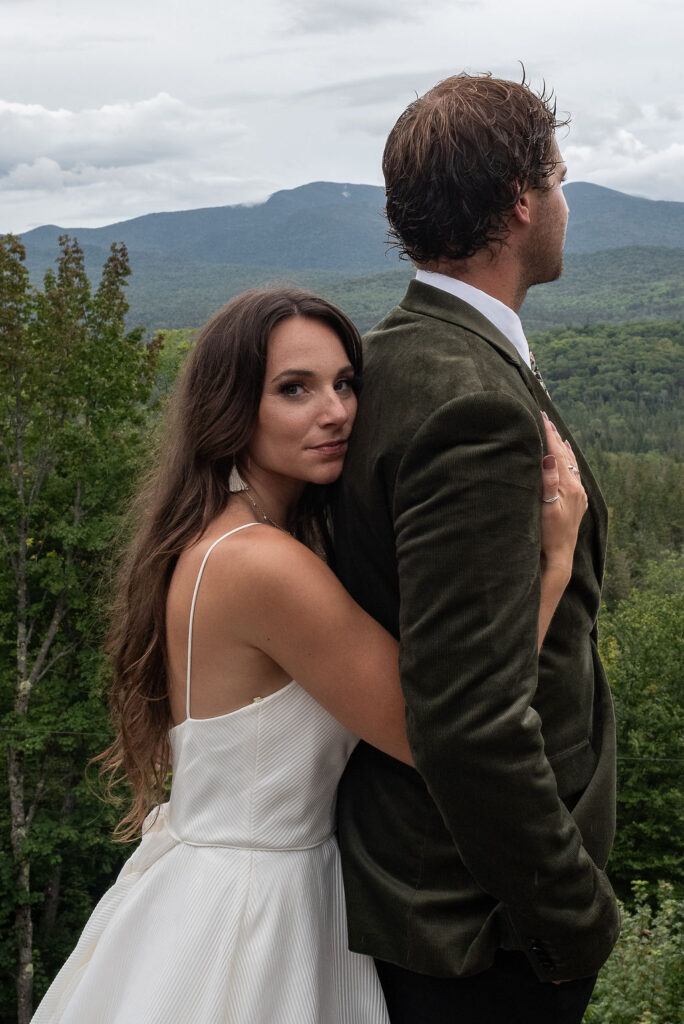 cute picture of the bride hugging the groom