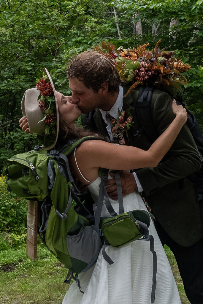 portrait of the bride and groom kissing