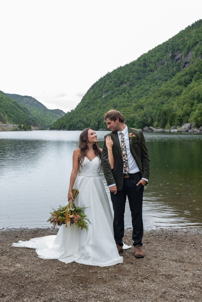cute portrait of the newlyweds smiling at each other