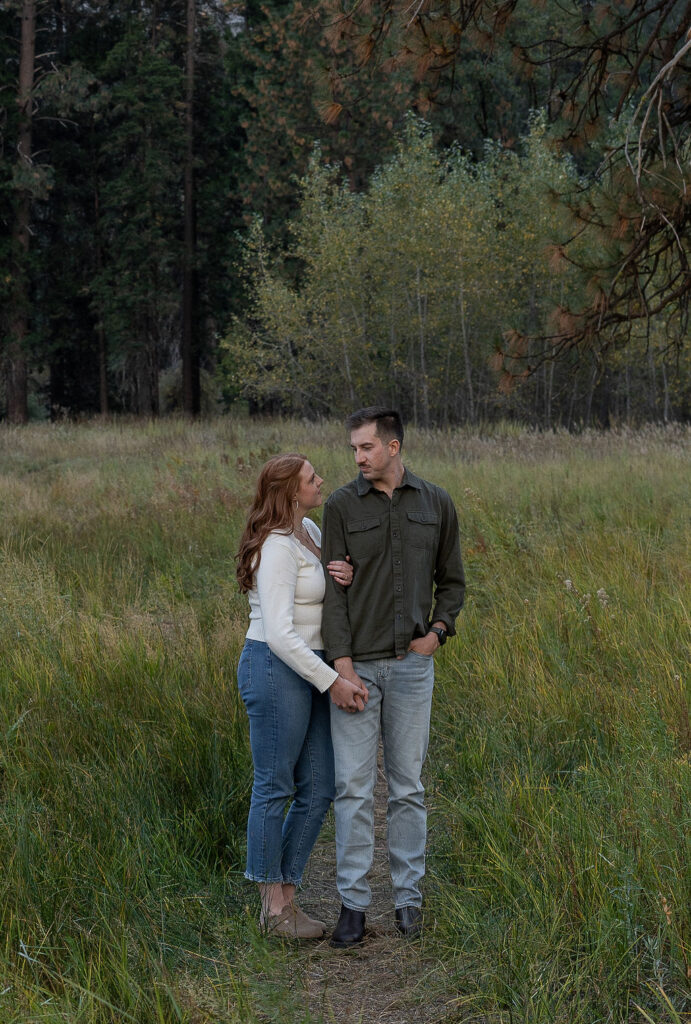 picture of the newly eloped couple smiling at each other during their photoshoot