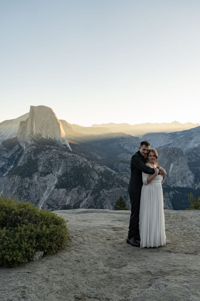 cute picture of the newlyweds kissing 
