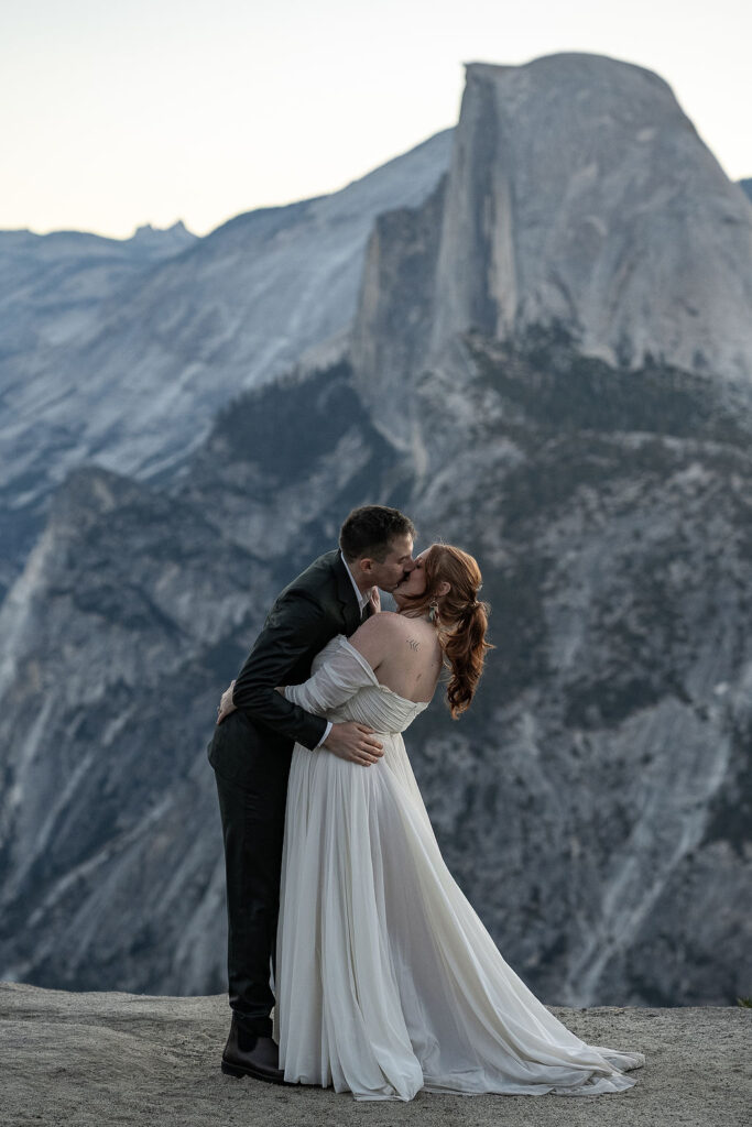 picture of the bride and groom kissing after their ceremony