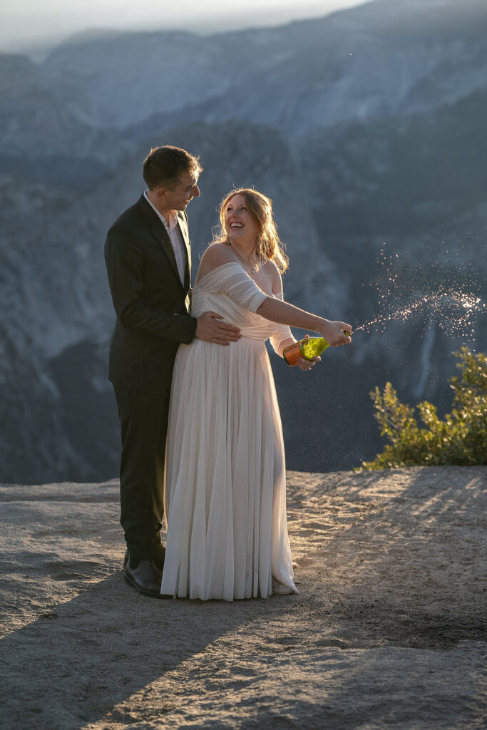 couple celebrating their elopement with champagne