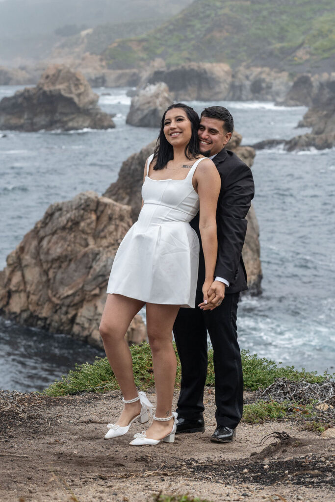 cute picture of the newly engaged couple kissing