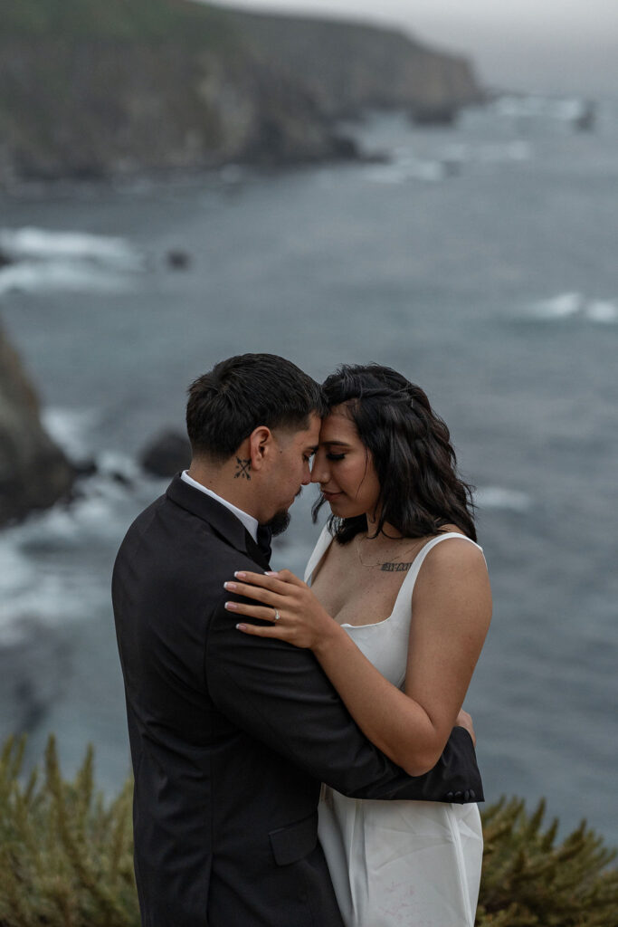 happy couple smiling at each other during their photoshoot