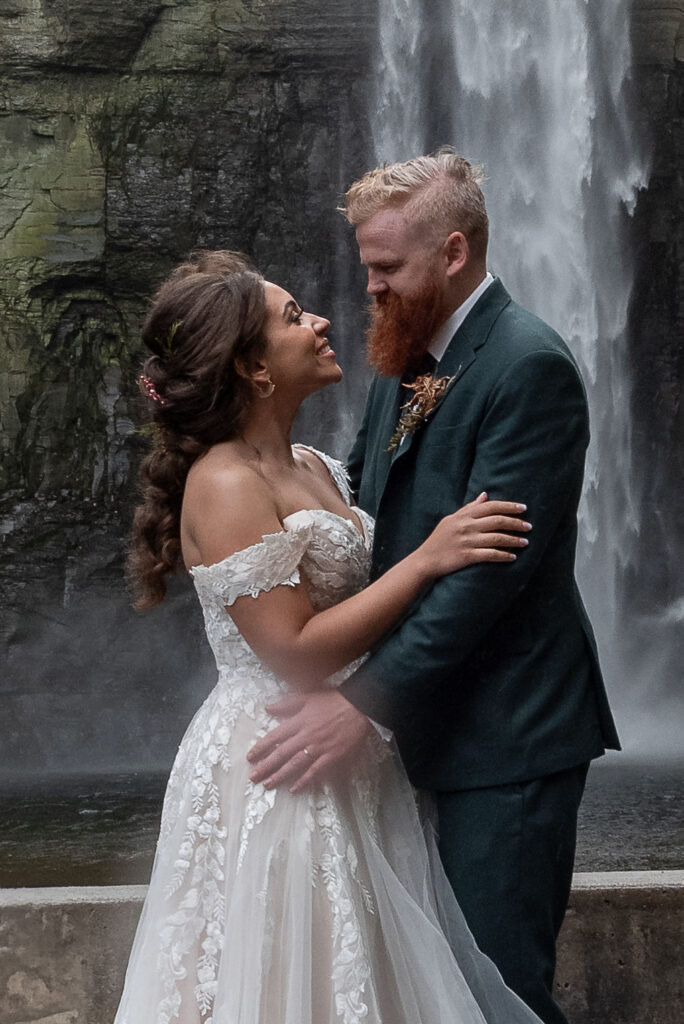 couple smiling at each other after their ceremony