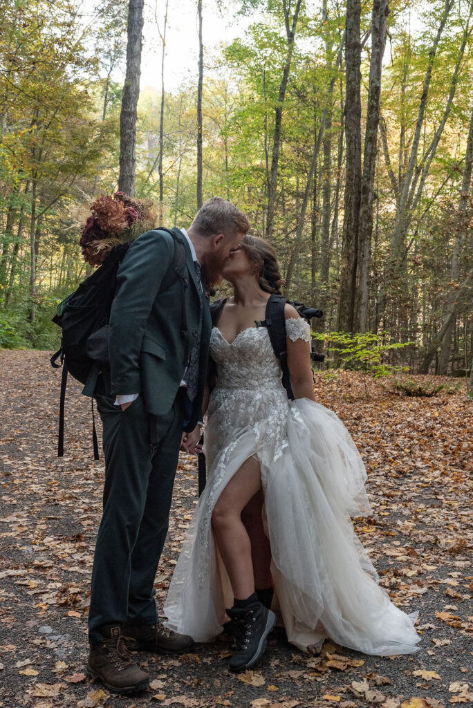 cute picture of the bride and groom kissing during their photoshoot