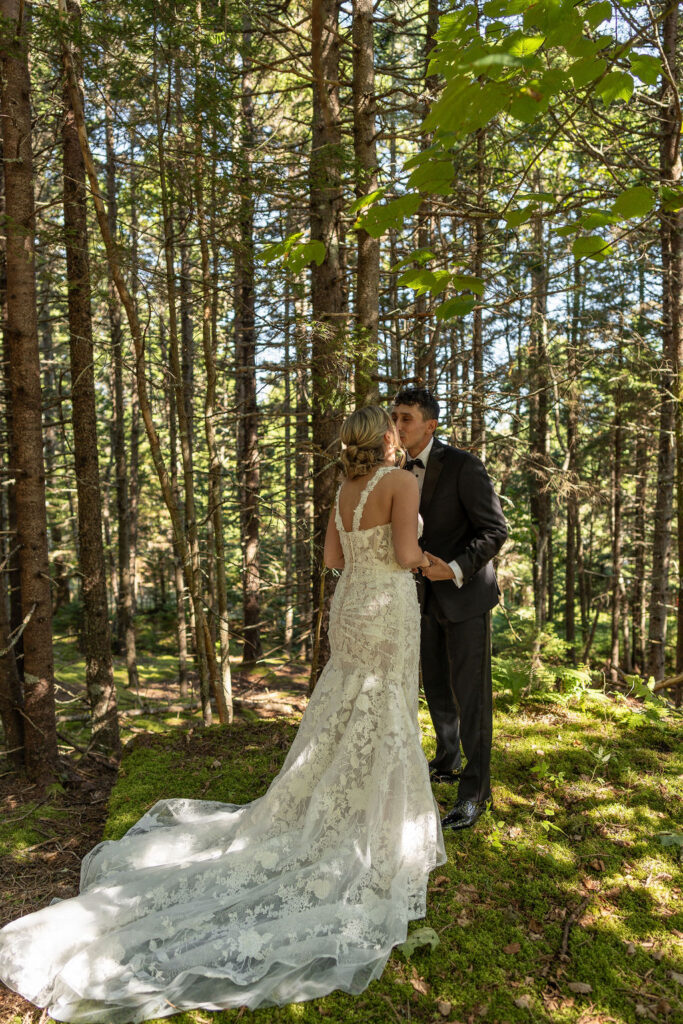 bride and groom kissing after their first look