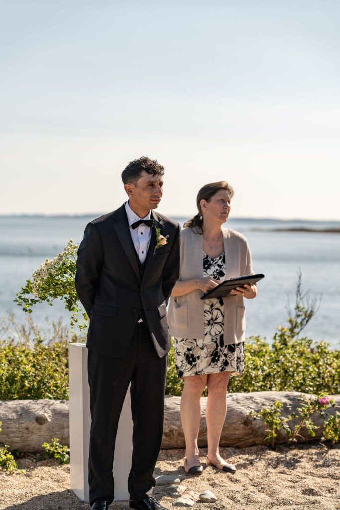 picture of the groom emotional seeing the bride walk down the aisle
