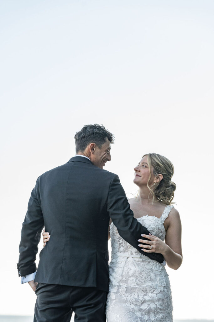 Picture of the newly married couple smiling at each other