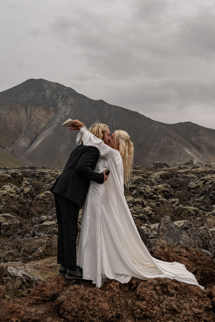 Couple kissing after their ceremony