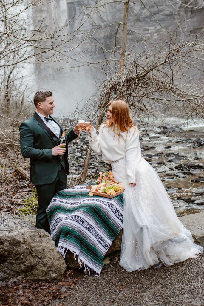 couple celebrating their elopement with champagne 
