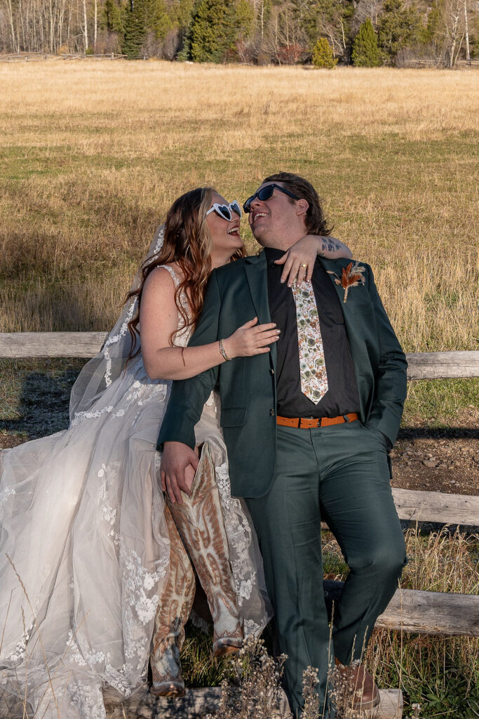 cute portrait of the newlyweds laughing with each other
