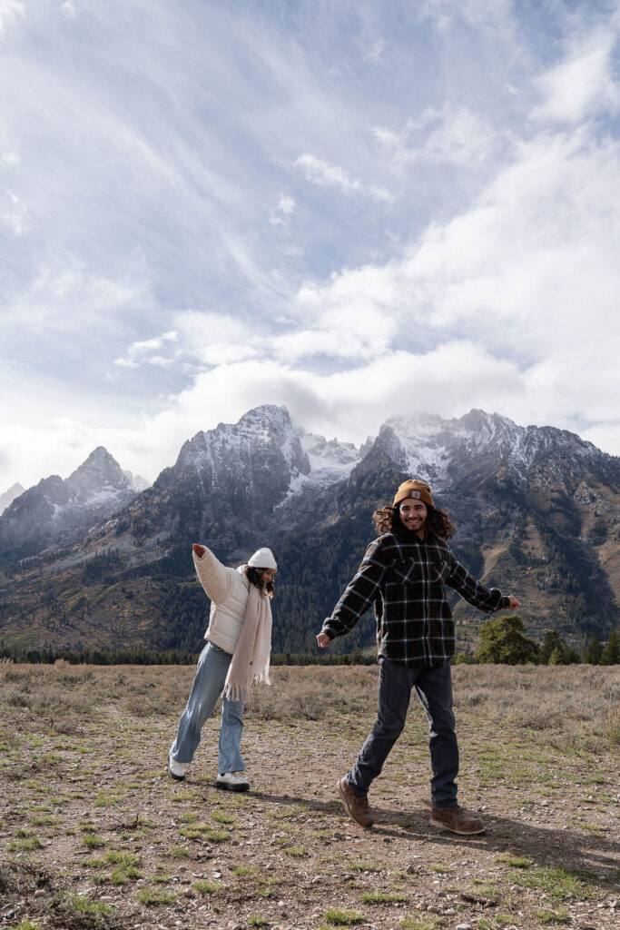 cute picture of the newlyweds playing during their photoshoot