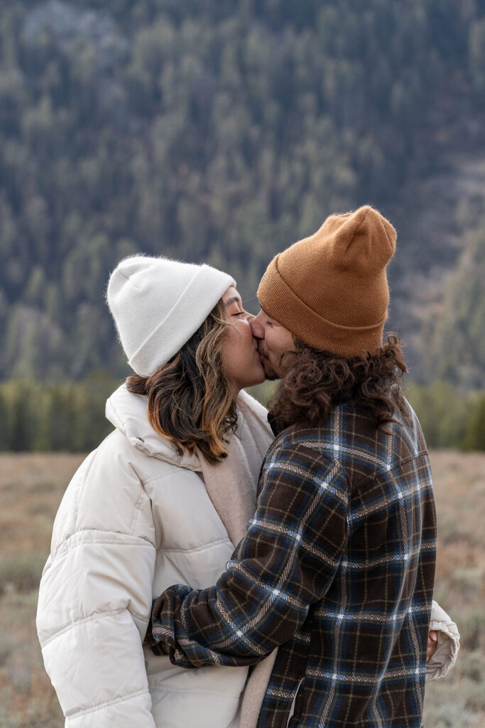 portrait of the newlyweds kissing