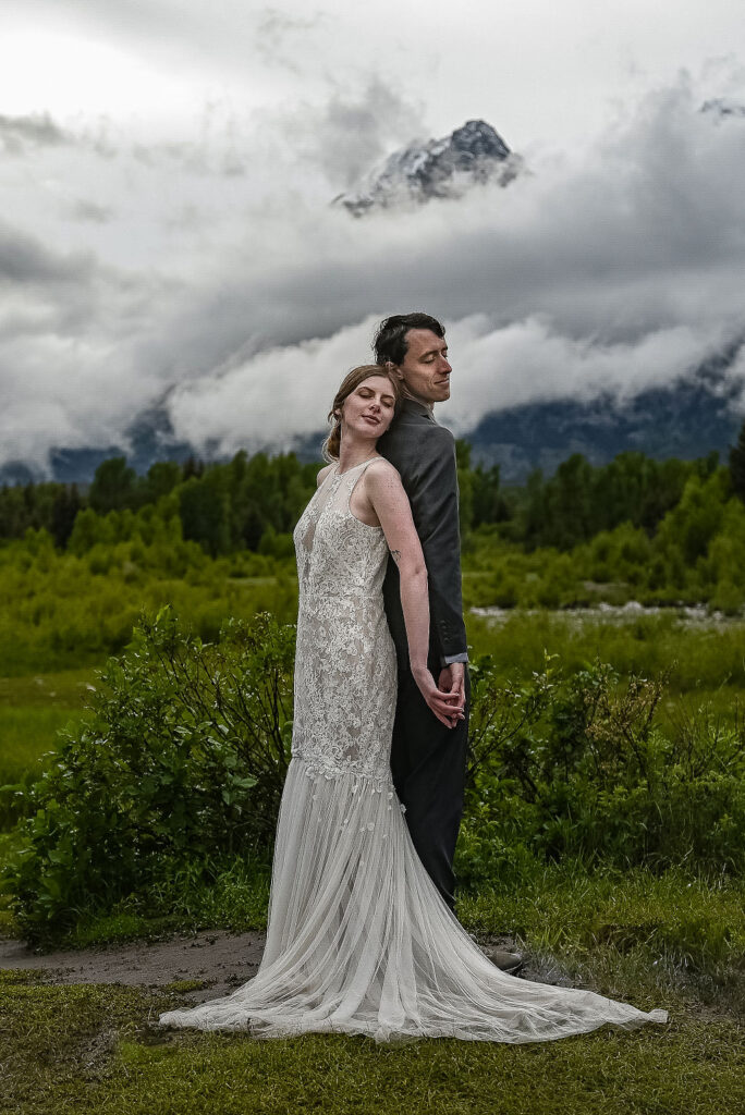cute portrait of the newlyweds holding hands