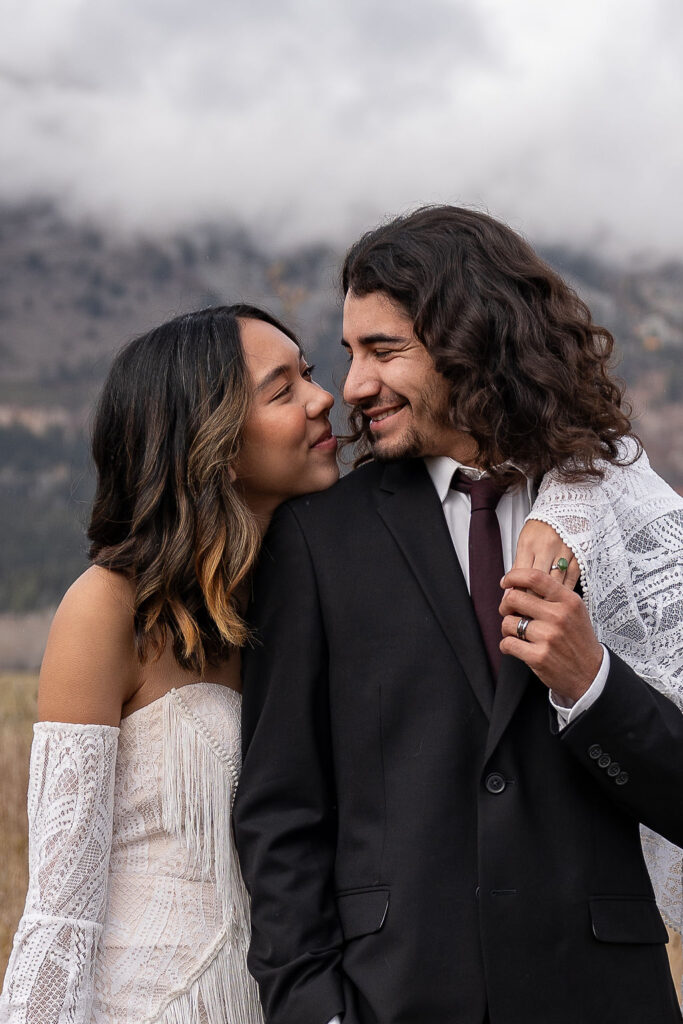 cute picture of the bride and groom smiling at each other