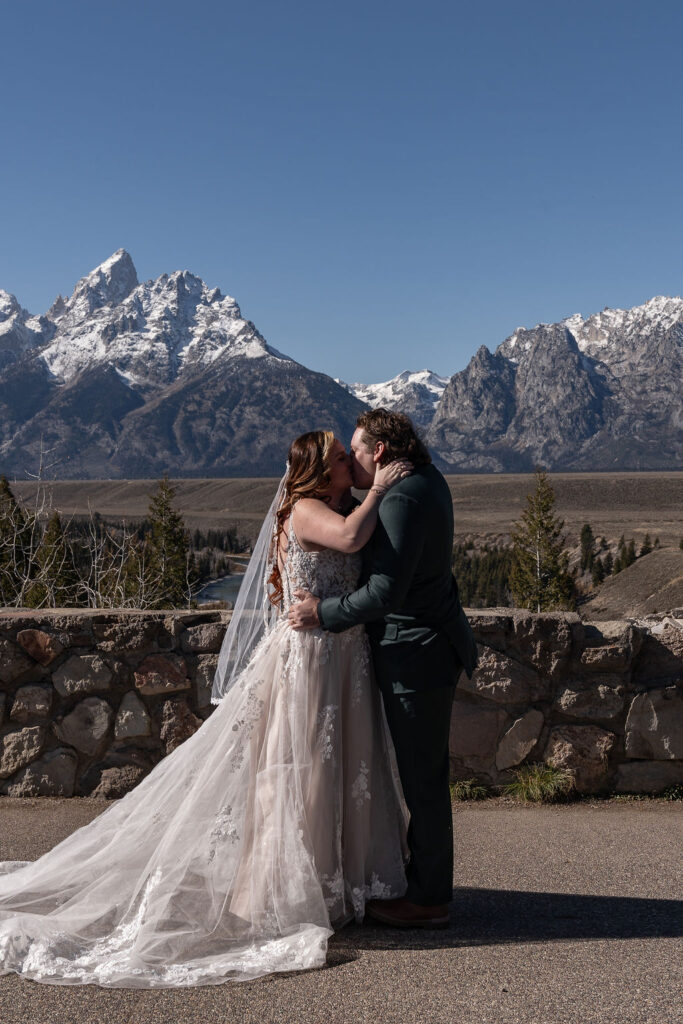 bride and groom kissing after their ceremony