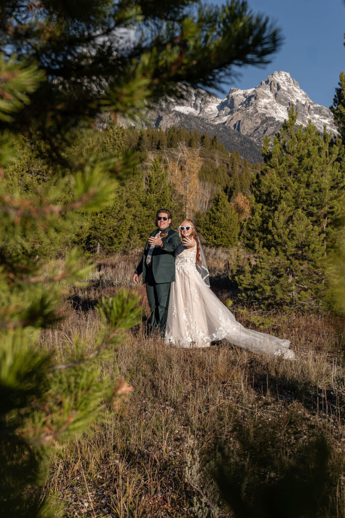 cute picture of the newlyweds showing their wedding rings 